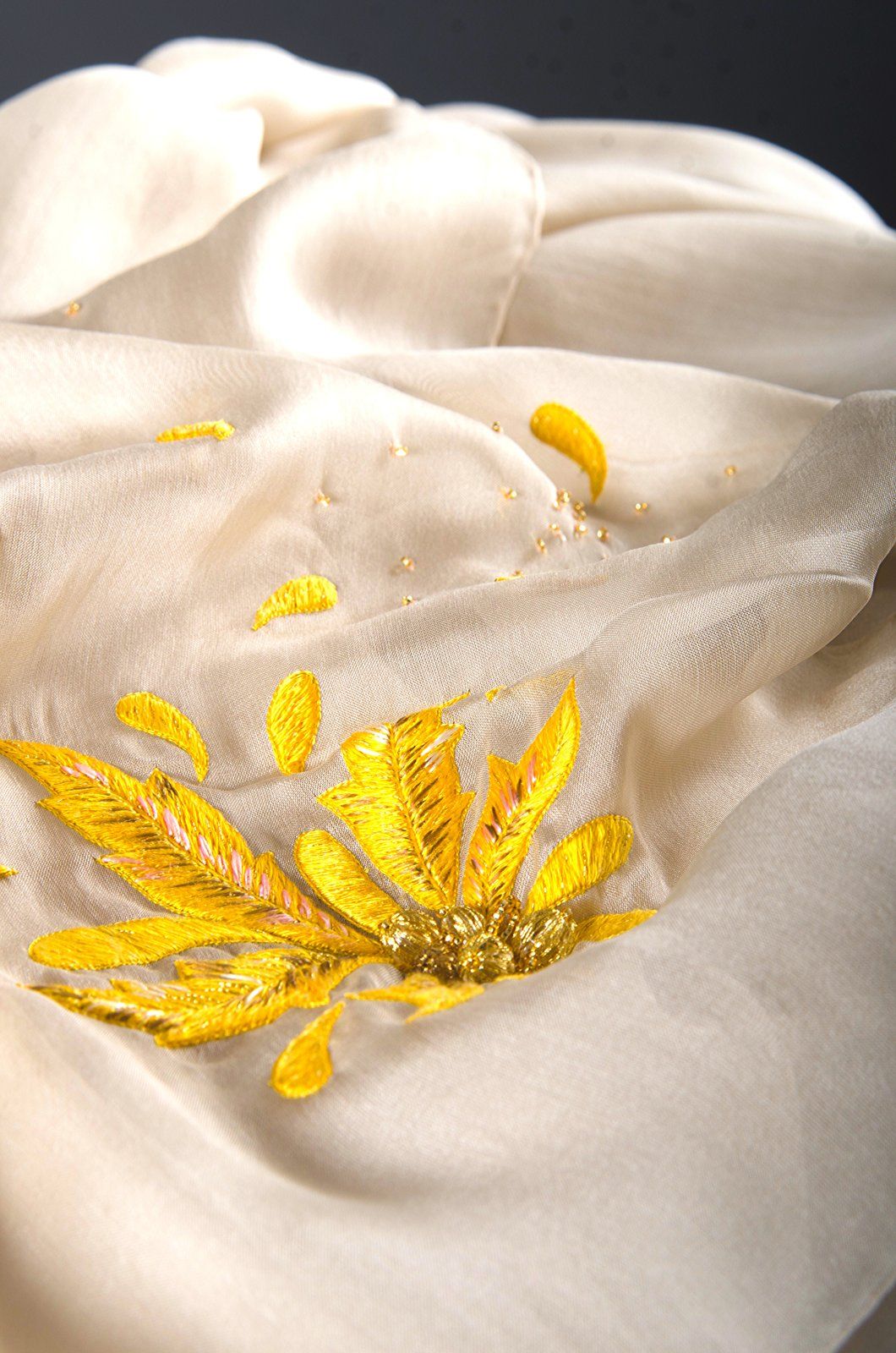 Golden spider silk embroidered on ivory silk