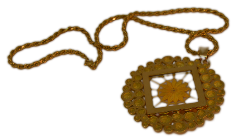 A pendant woven in golden spider silk
